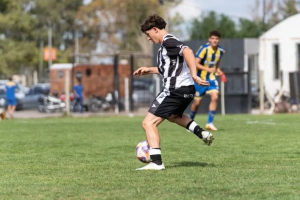soccer player dribbling ball